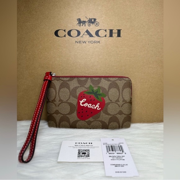 Coach Handbags - COACH wristlet Strawberry 🍓 still wrapped in Coach plastic!  NWT